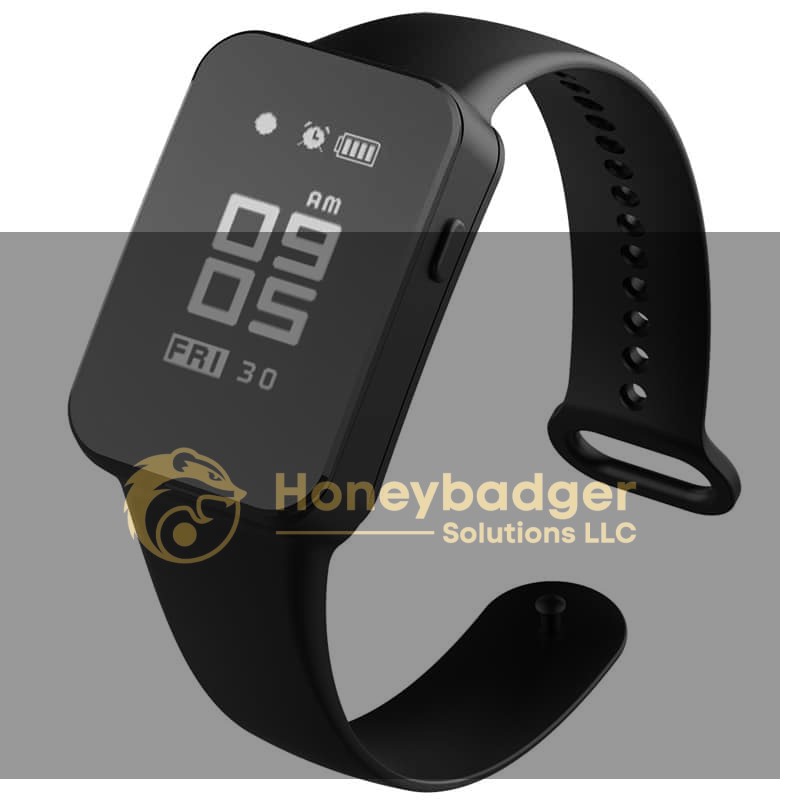 Black digital smartwatch with a rectangular display showing time, date, and battery icons.