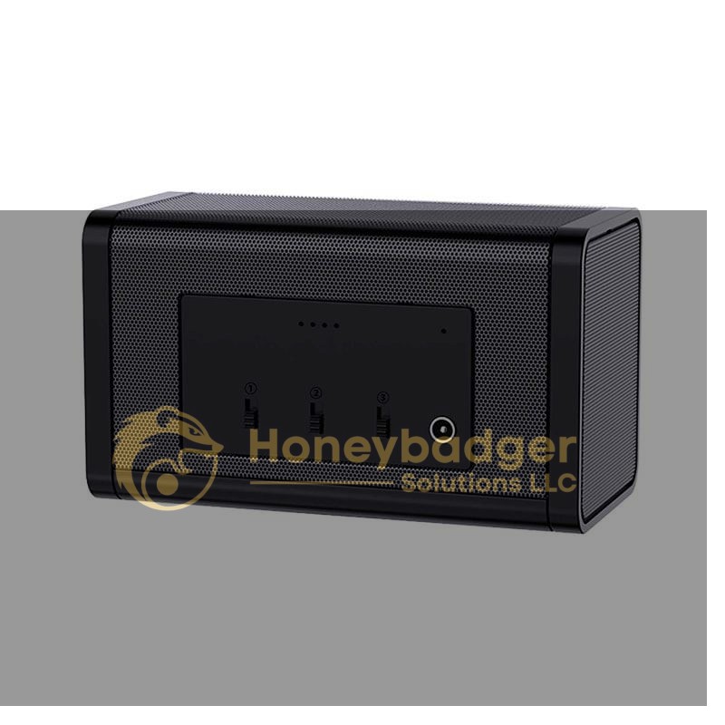 Rectangular black wireless speaker with a mesh front, rounded edges, and control buttons on the front panel.