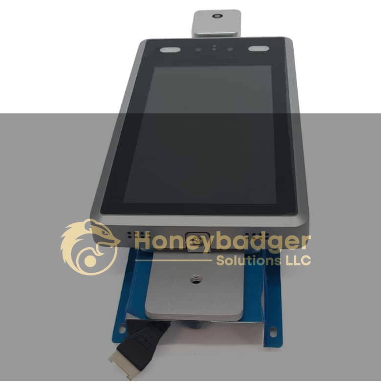 Wall-mounted body temperature scanner camera with a touchscreen and USB cable connection on a blue stand.