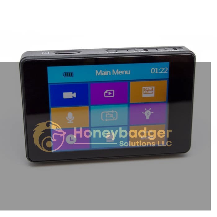 Black rectangular digital device with a color touchscreen menu for video, photo, audio, and settings.