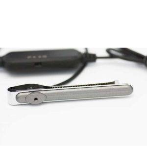 A silver metal tie clip camera with a black USB cable on a white background.