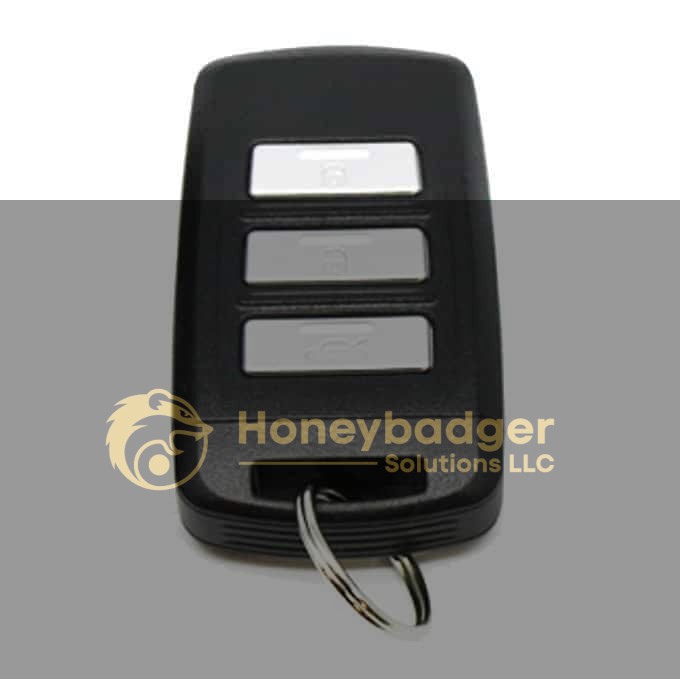 Black car key fob featuring three silver buttons and a metal keyring.