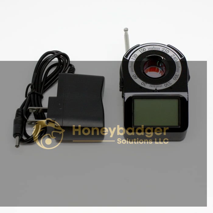 A black Camera Finder with RF Detector featuring a digital screen, compass, and antenna next to its black power adapter with a cord.