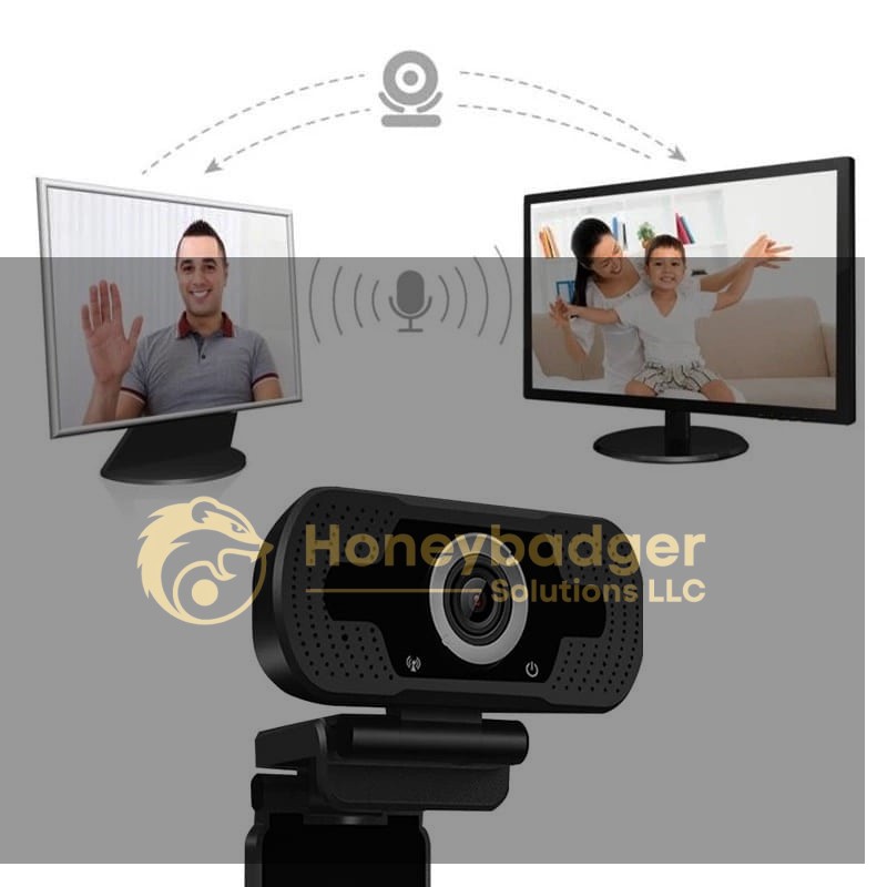 A 1080P webcam positioned in front of two monitors displaying video calls with a man and a woman with a child.