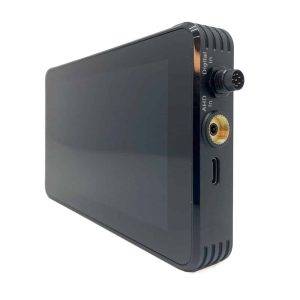 A black digital video recorder with a large touchscreen and various side ports including a round connector and USB-C.