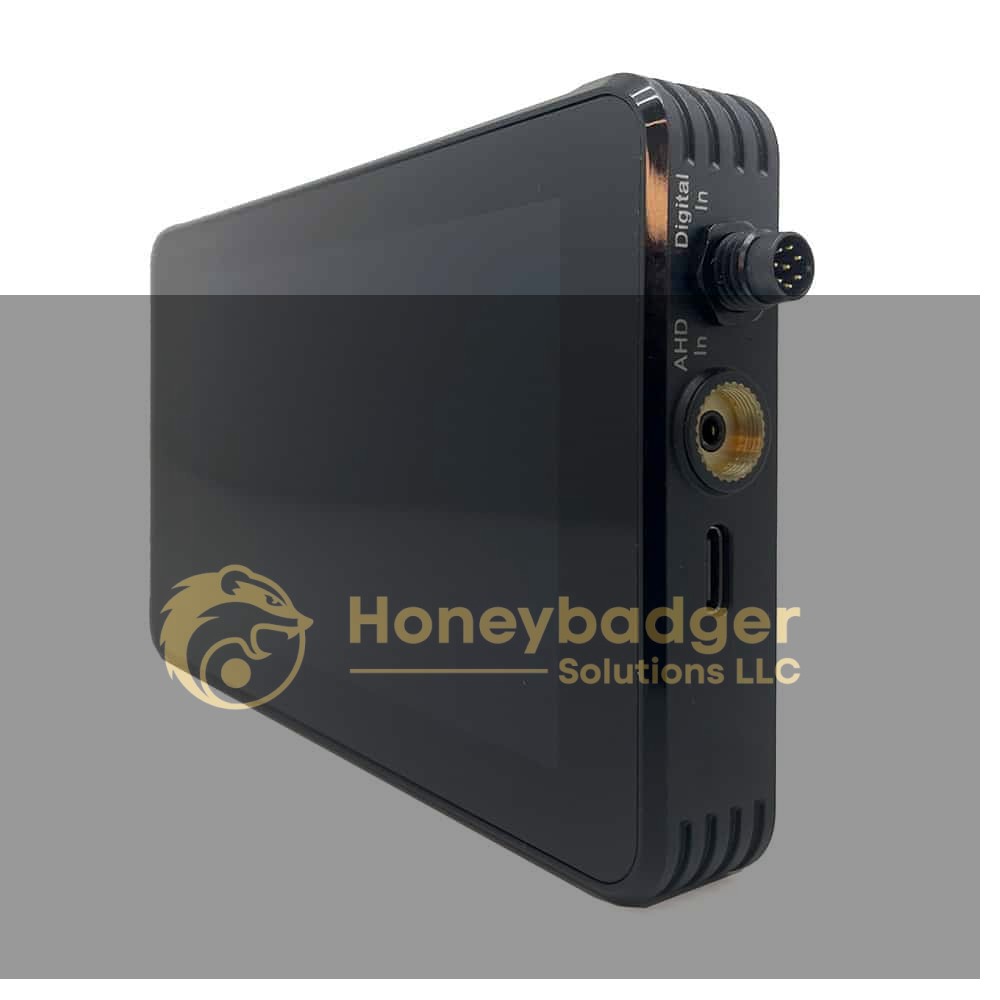 A black digital video recorder with a large touchscreen and various side ports including a round connector and USB-C.