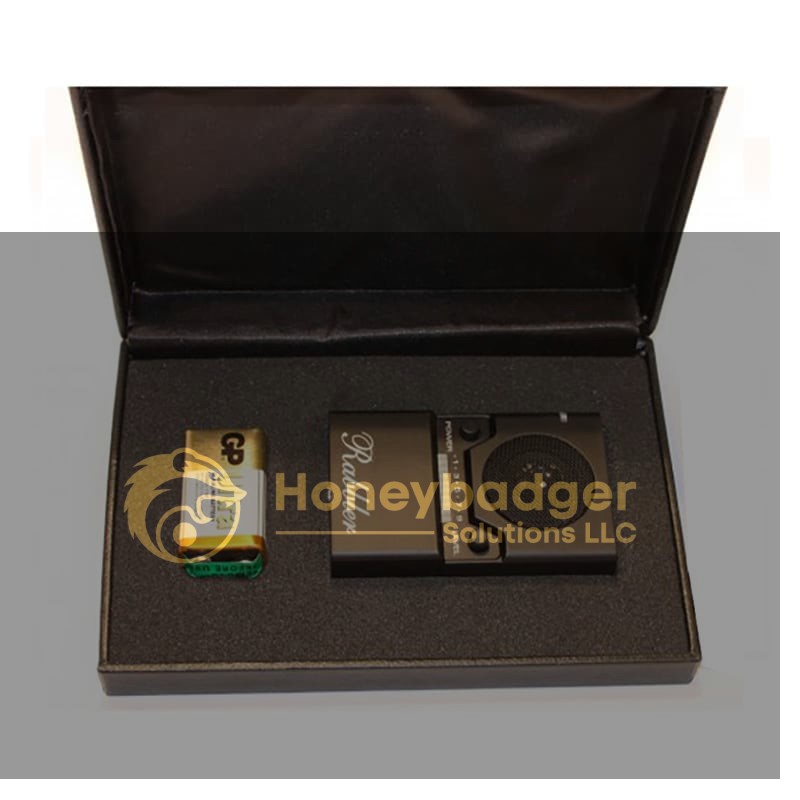 A black presentation box containing a compact black Rabbler Noise Generator and a 9V battery, both secured in custom-cut foam.