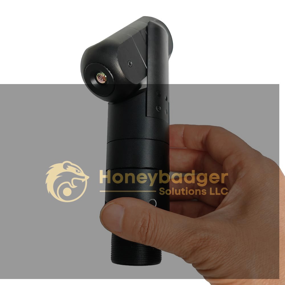 A hand holds a 4K Thermal Pole Camera with Pan Tilt Zoom, a black cylindrical device with an angled camera lens.