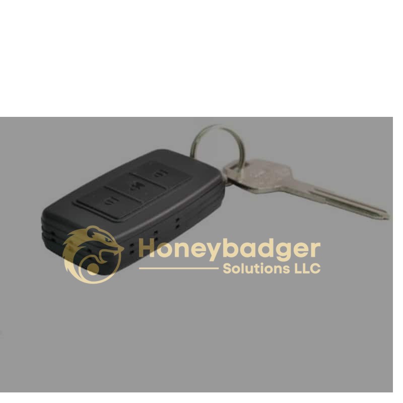 A black rectangular key fob voice recorder with three buttons and a metal key ring attached.