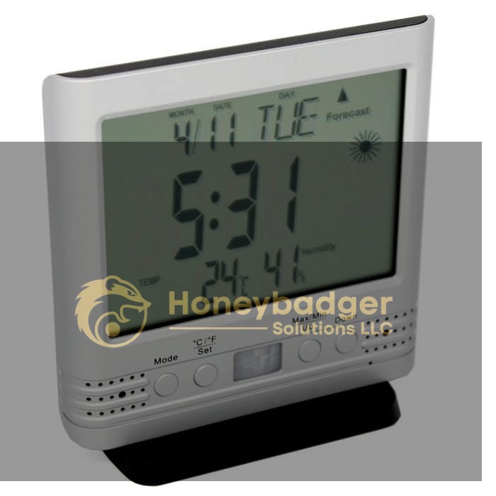 Weather Clock Cam HD displaying date, day, time, temperature, humidity, and weather forecast with control buttons below.