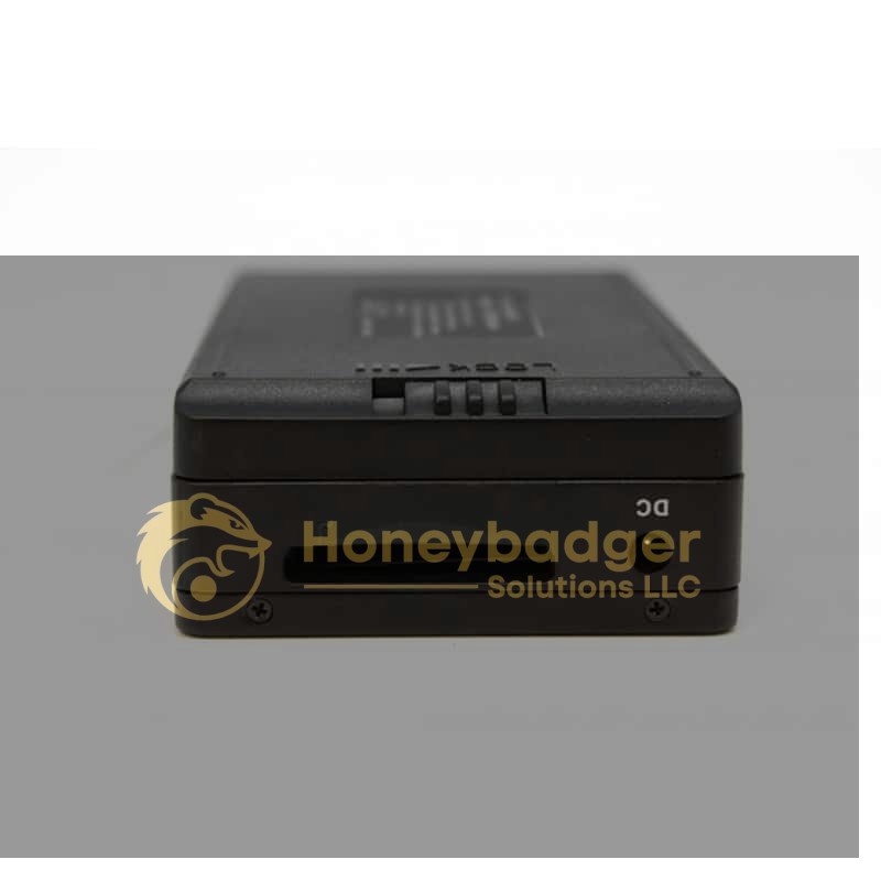 Close-up view of a black HD DVR with a card slot and DC power input on a plain background.