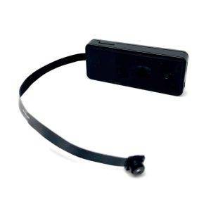 A compact black pinhole hidden camera with a flat cable and small lens for discreet surveillance.