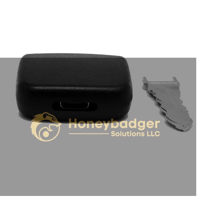A black rectangular Personal Car Key Voice Recorder with a separate silver car key blade beside it on a white background.