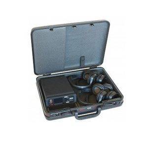 A black hard-shell carrying case with foam compartments holding several pairs of black headphones and a Druid Noise Generator.