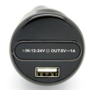 Close-up view of a car charger showing input/output specifications: IN: 12-24V, OUT: 5V/1A.