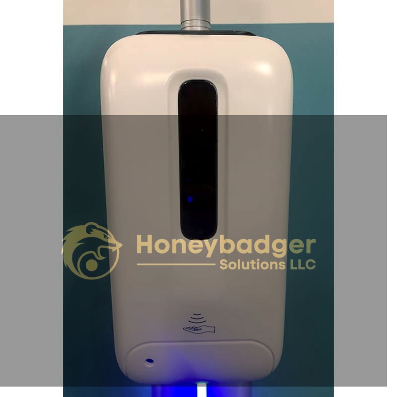 Wall-mounted automatic hand sanitizer dispenser with a sensor panel and hand icon for sanitizing.