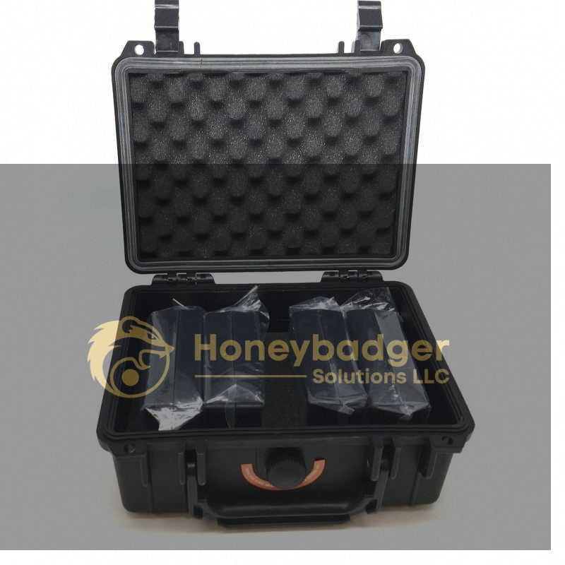 A black hard plastic carrying case with foam padding containing four wrapped items inside. The case is open, showing organized storage.