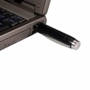 A close-up of a laptop with a One-Touch Pen Voice Recorder connected to a USB port for audio recording.