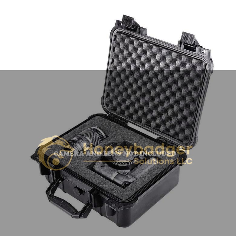 Waterproof protective case shown open with egg-crate foam and custom inserts, designed to hold a camera and two lenses. CAMERA AND LENS NOT INCLUDED.