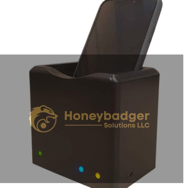 Black digital forensics device with a slot for a smartphone, three indicator lights, and a side USB port.