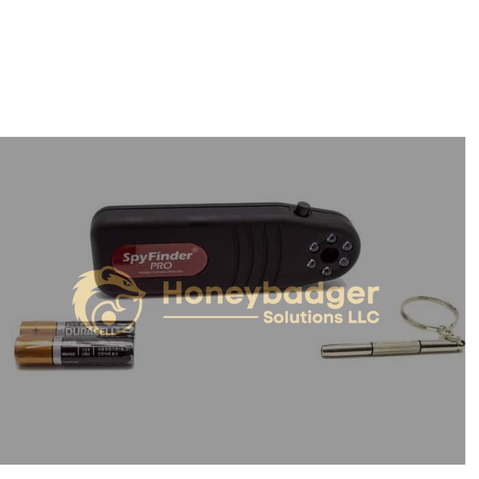 Black SpyFinder Pro device alongside two AA Duracell batteries and a small metal keychain on a white background.
