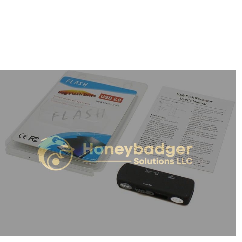 USB style voice recorder in black with clear plastic packaging labeled 'USB Flash Drive' and a user manual on a white surface.