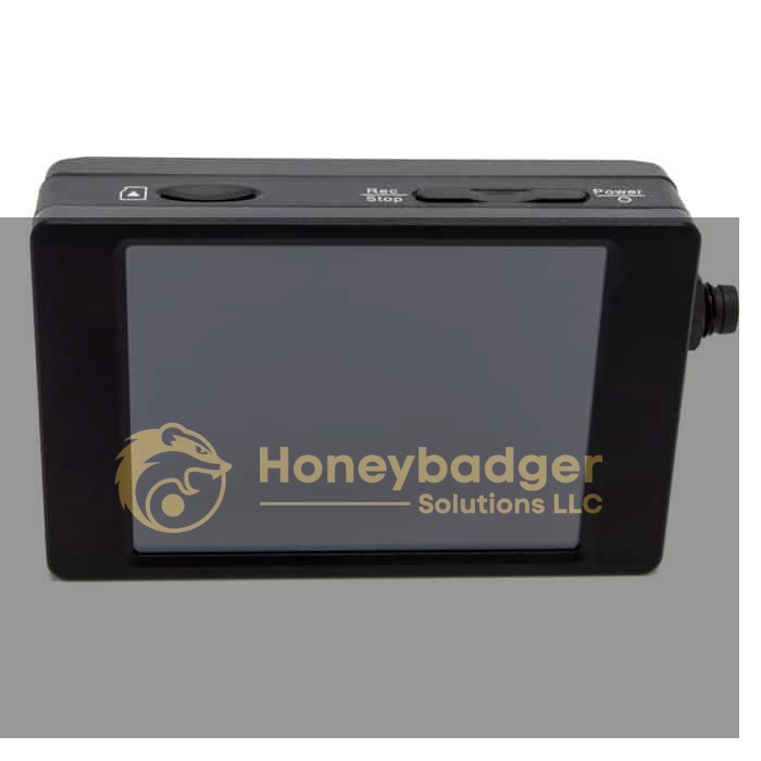 A small black rectangular handheld device with a large screen and buttons labeled 'Menu,' 'Rec/Stop,' and 'Power.'