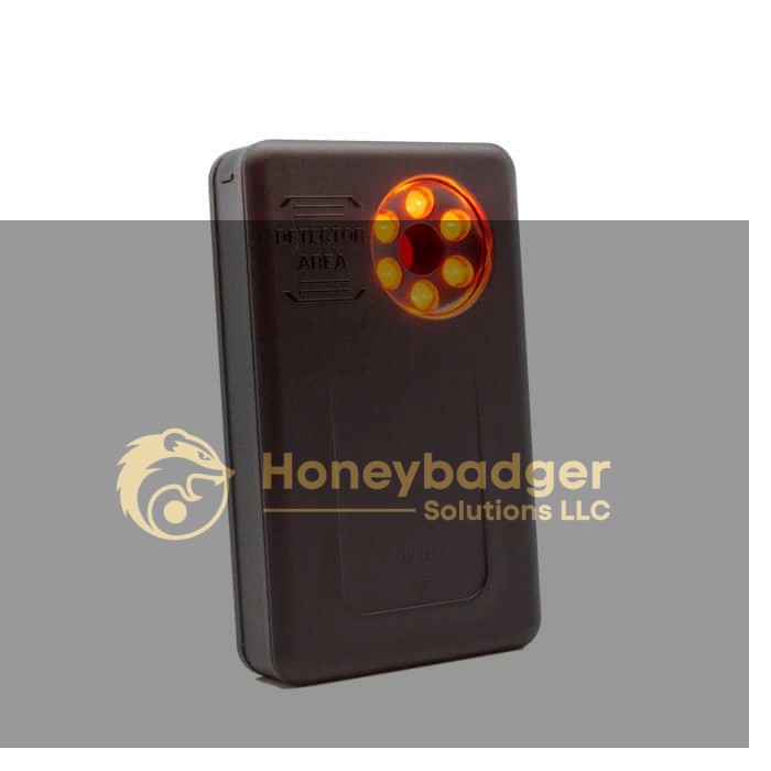 Compact black LawMate Pocket RF Detector with a circular detection area and red-orange lights for RF signal detection.