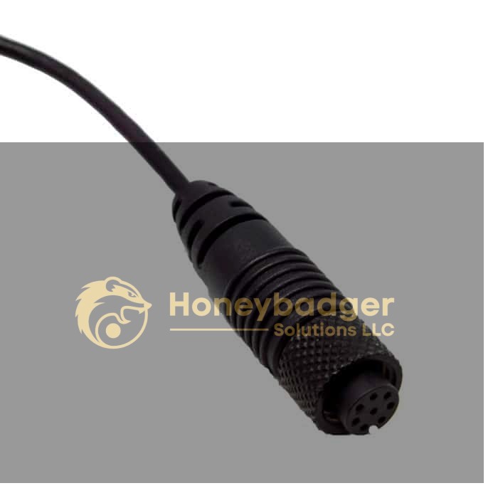 Close-up of a black, round 5-hole electrical connector with textured grip at the end of a cable.