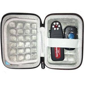 A gray padded carrying case open to reveal the SpyFinder Pro device and a remote control inside, secured with elastic straps.