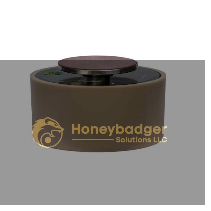 A beige cylindrical transducer for a white noise generator with a flat top and compact control panel.