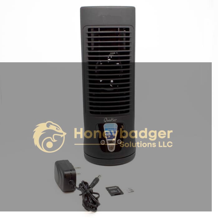 QuietFan oscillating fan with control panel, power adapter, memory card, and USB adapter on a white background.