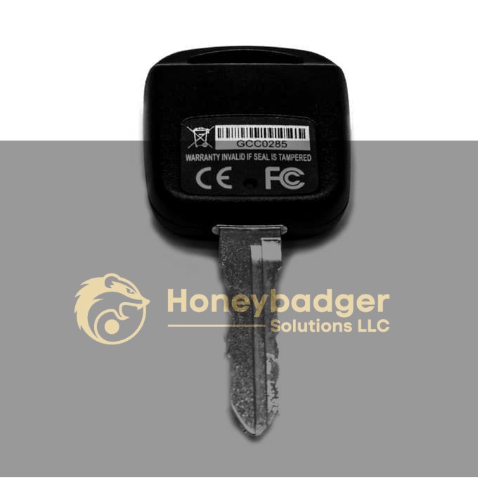 Personal Car Key Voice Recorder with a black plastic head, barcode, and metal key blade pointing down.