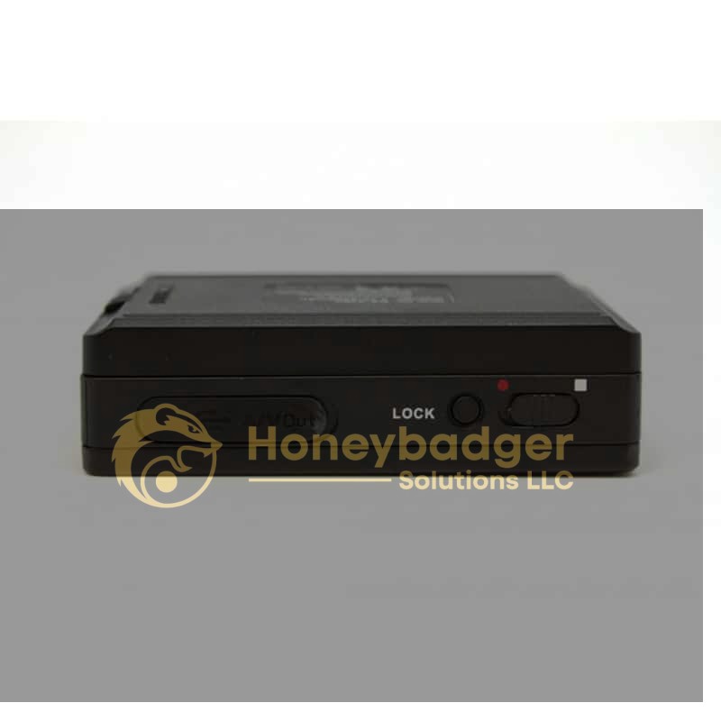 Close-up view of an HD DVR with Button Camera Set, featuring a sliding lock switch, AV out port, and a small red indicator light.