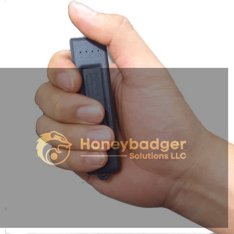 A hand holds a small black Digital Voice Recorder & Power Bank labeled 'POWER' against a white background.