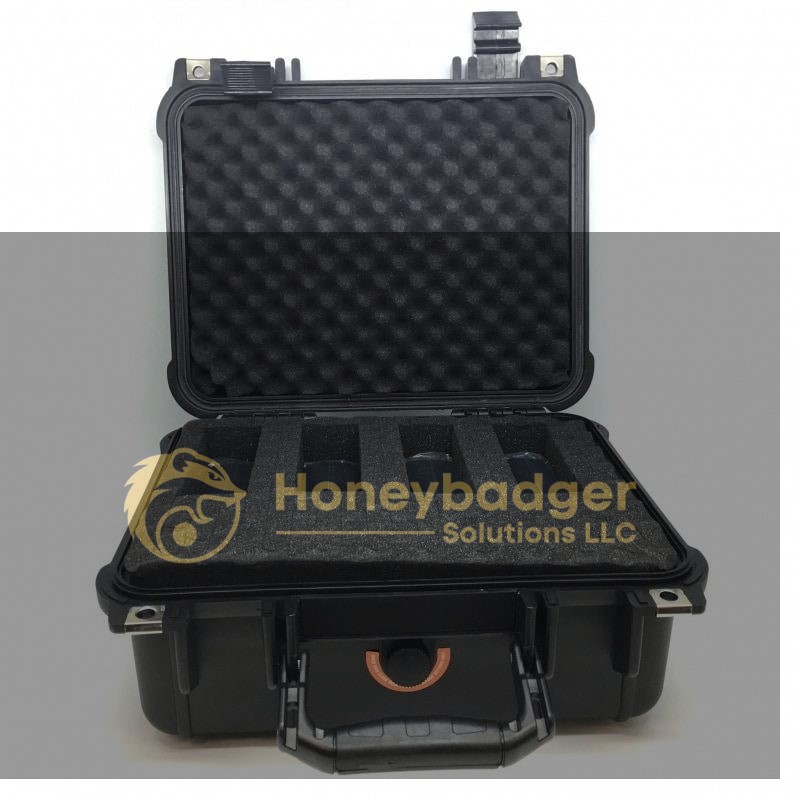 Black hard-shell case with foam padding and four rectangular cutouts for secure gear storage.