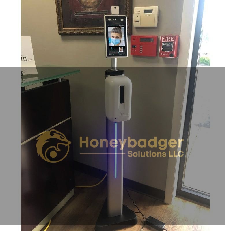 TMT2 Camera on a 4 ft stand with a hand sanitizer dispenser and blue LED strip in an office setting.