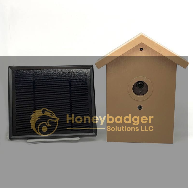 SG Xtreme Life Bird House in tan color with a round lens, accompanied by a black solar panel on a white background.