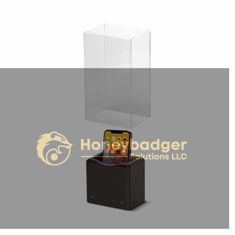 The Phone Safe Ultra - NG4100 securely holds a smartphone upright in a black box with a clear rectangular cover.