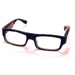 A pair of thick-rimmed black glasses with rectangular lenses resting on a white surface.