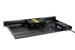 Firewalla Gold Rack Mount, a black metal server rack shelf with ventilation slots and a power adapter connected by cables.