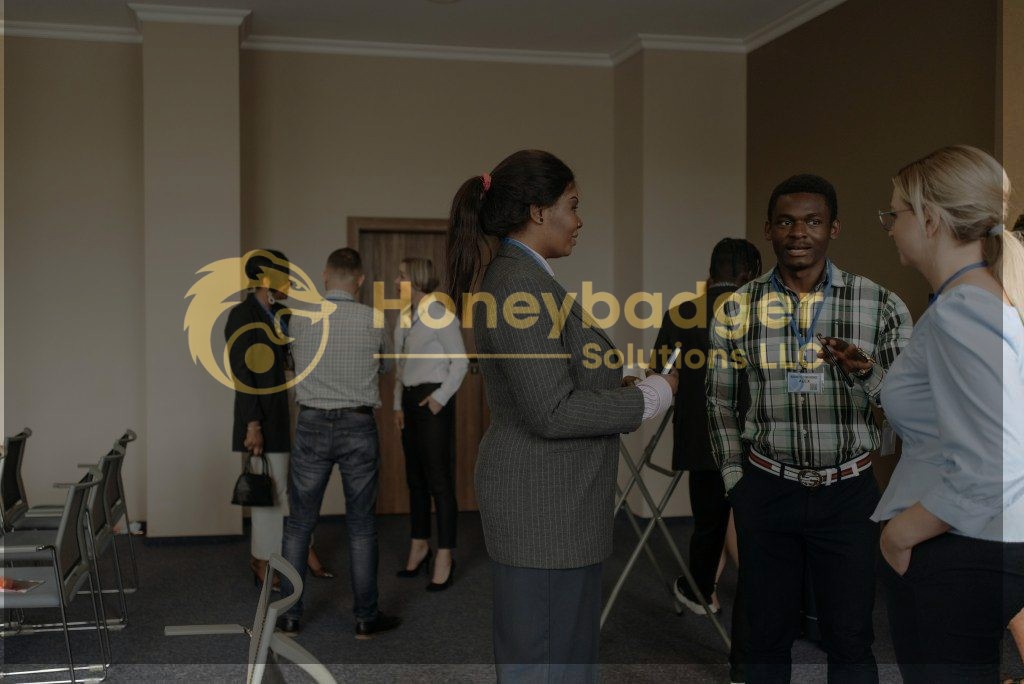 Group of business professionals interacting during a corporate event in a conference room.