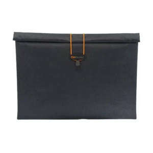 GO DARK laptop sleeve in dark fabric with an orange accent and closure mechanism.