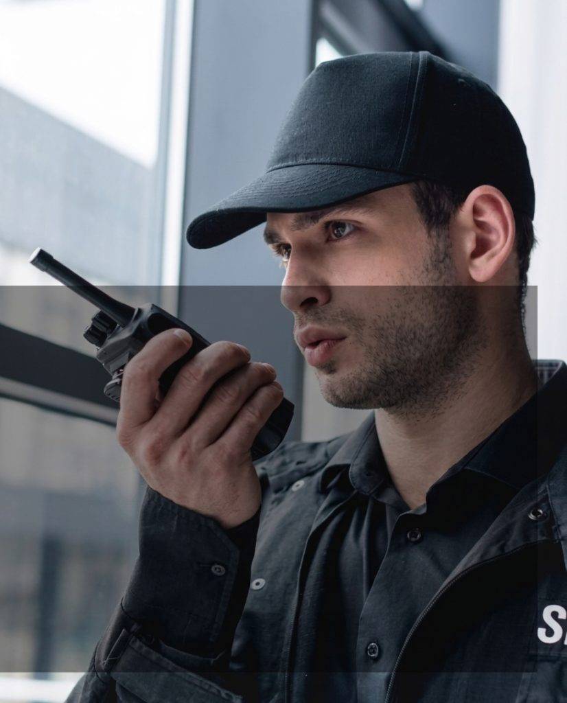 Dw2 cropped view of guard in uniform talking on walkie 2022 12 16 17 11 42 utc 1.jpg