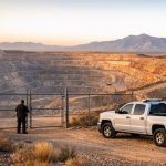 Mining security patrol at a perimeter gate of an Arizona open-pit copper mine