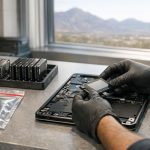 Technician removing an SSD for NIST 800-88 media sanitization at a secure workbench