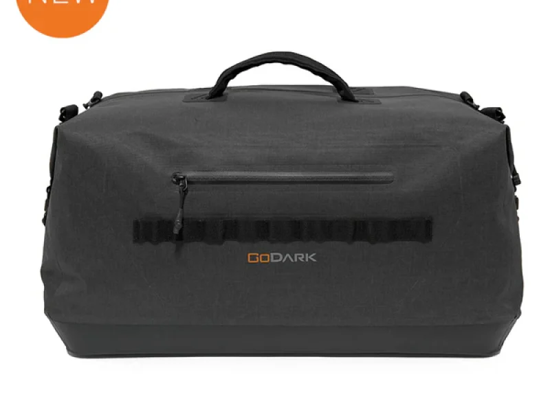 GO DARK duffel bag in black with a durable exterior and carrying handles.